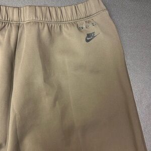 818.   Nike Tech Pack women’s Tan performance  pant with elastic waist size L